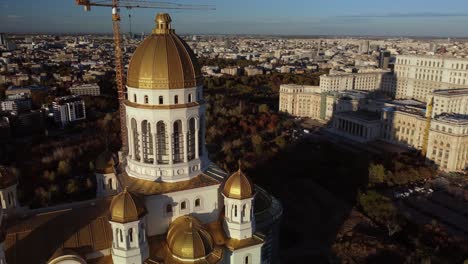 close-up parallax view of the construction site of the cathedral of the salvation of the nation, bucharest, golden hour