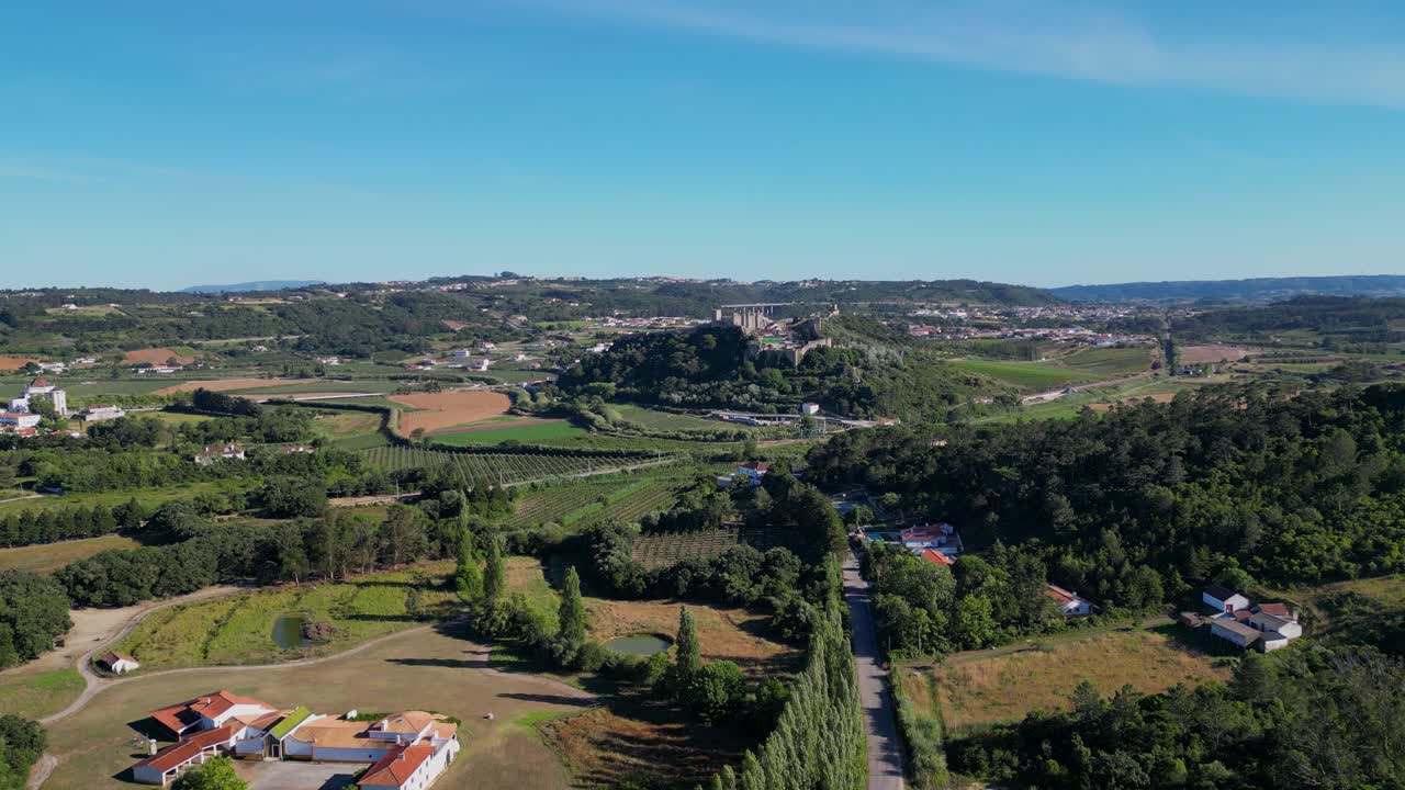 Aerial View of a Historical Town and Rural Landscape with Vineyards