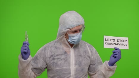 healthcare worker holding syringe and sign saying let's stop coronavirus