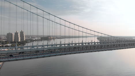 sunrise aerial drone footage of benjamin franklin bridge in philadelphia