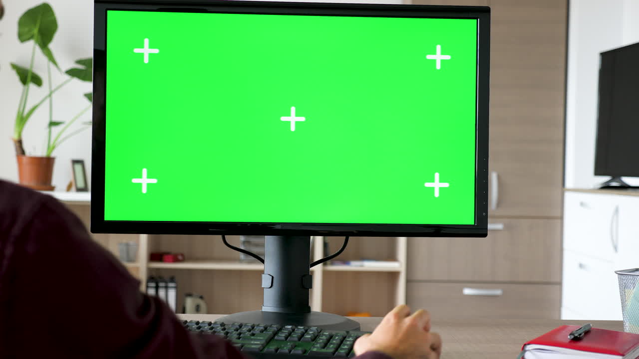 Computer Monitor with Green Screen in Office