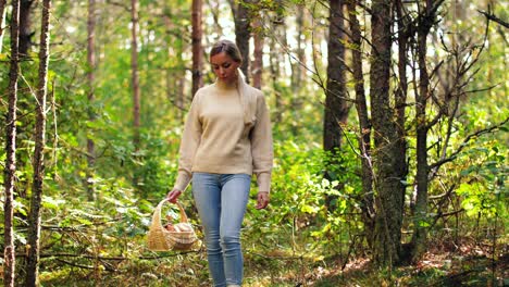 woman picking mushrooms in the forest