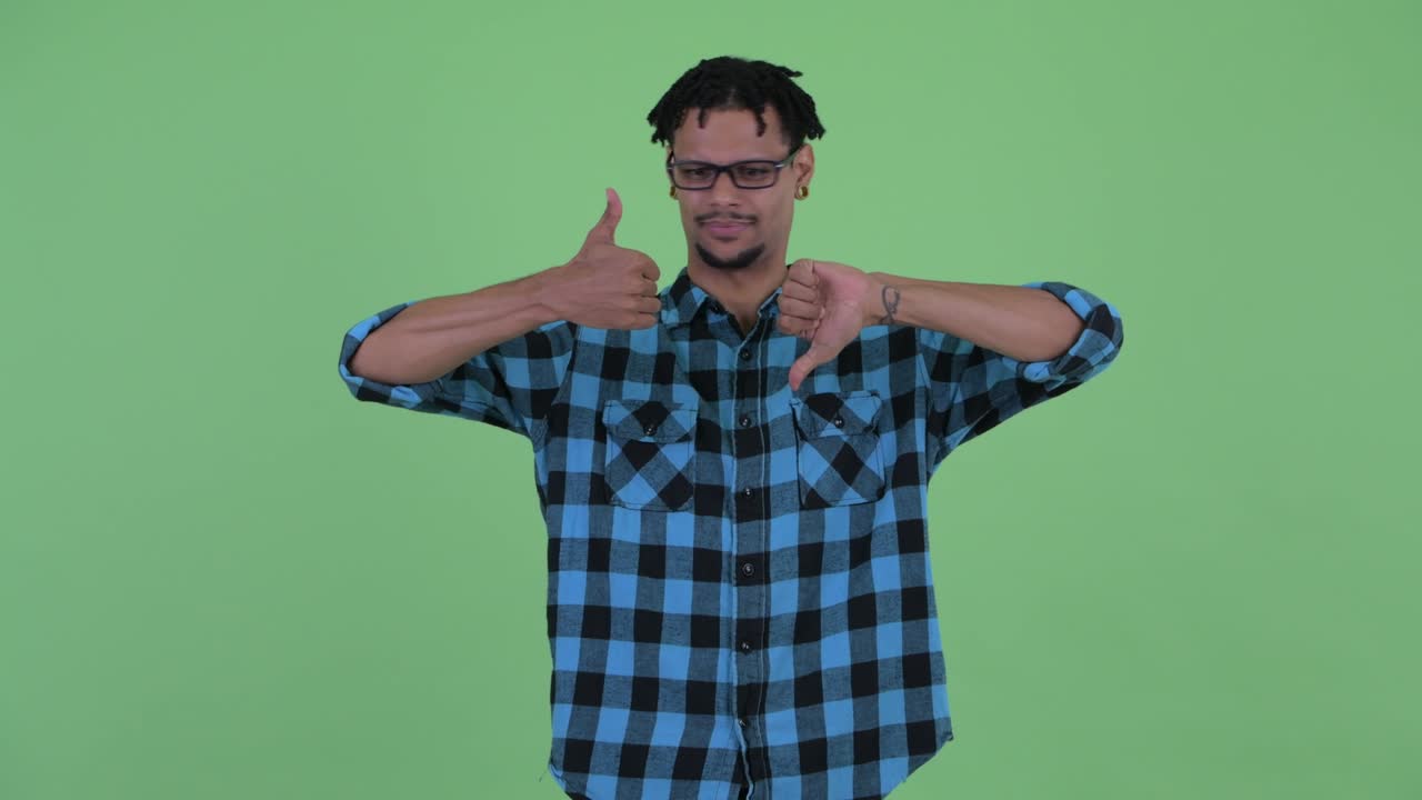 Young handsome African hipster man with dreadlocks