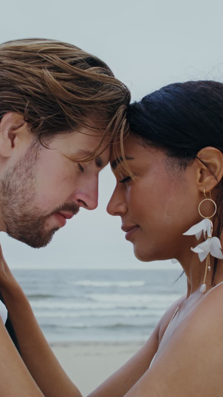 A loving couple embracing at the beach