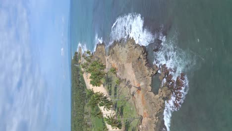 Aerial-view-of-waves-crashing-against-shore-of