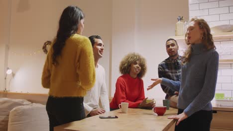 millennial adult friends socialising together at home