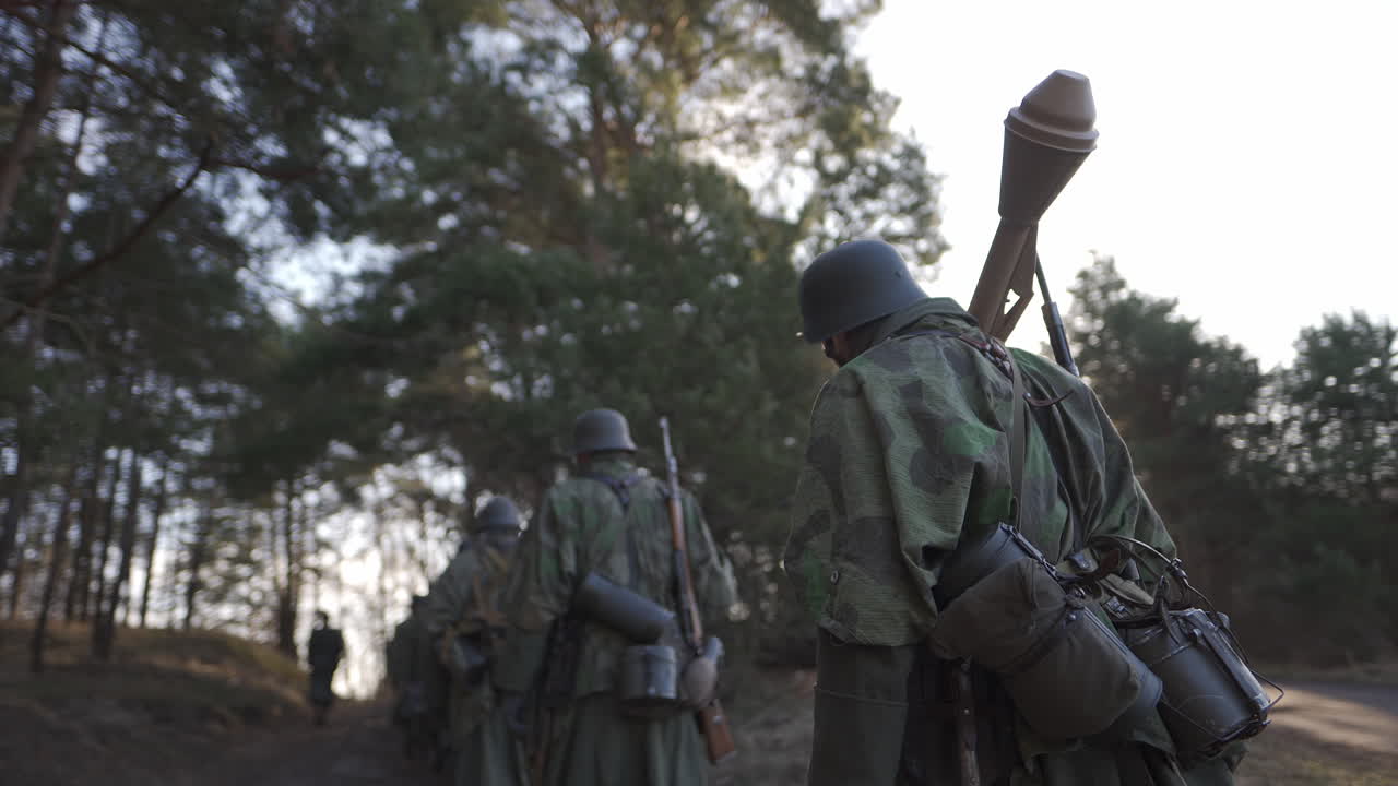 German Soldiers Marching Through Forest in WWII