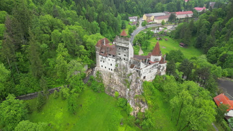 fantastic aerial view of bran castle, a medieval castle located in the carpathian mountains, romania