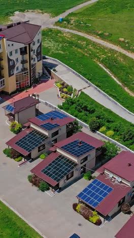 aerial view of resort complex with solar panels