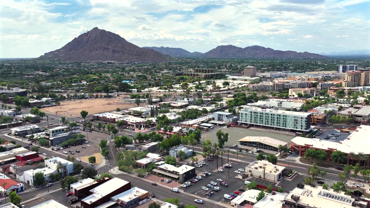 Downtown Scottsdale Arizona USA with camelback mountain in the background - aerial Drone video