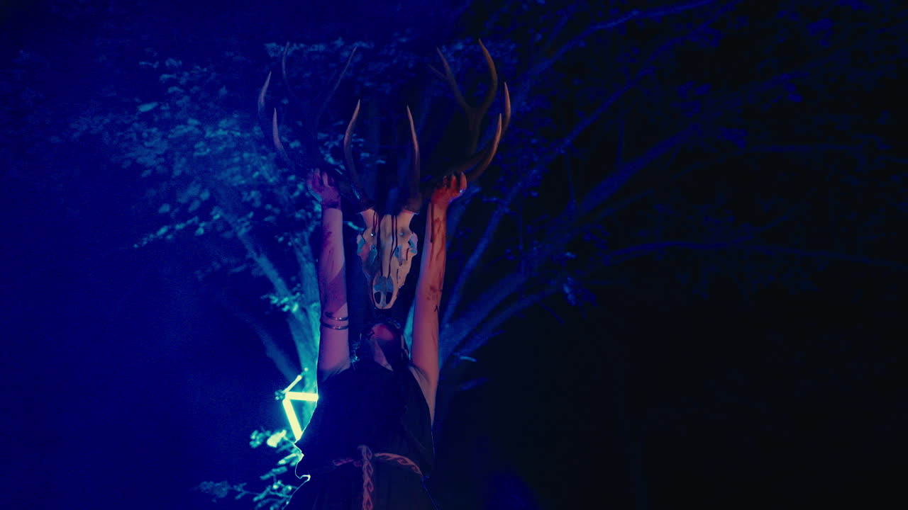 Woman with Deer Skull and Antlers