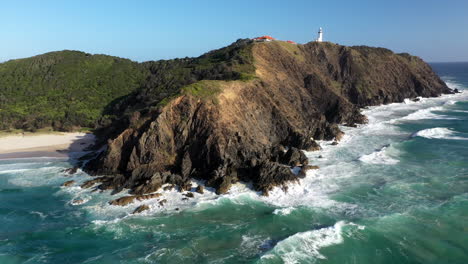 cinematic rotating drone shot of cape byron lighthouse, australia