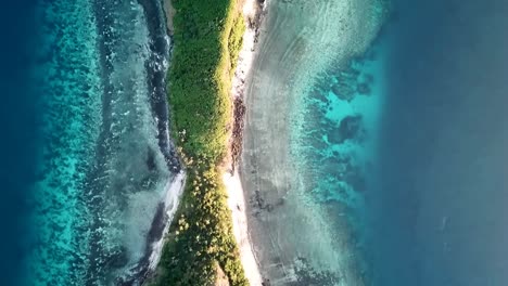 fiji - flying over a remote island next to mantaray island