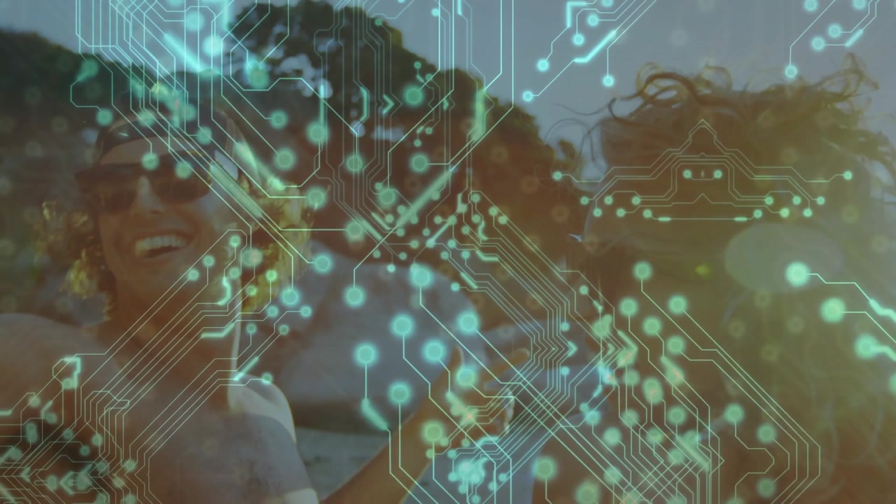 Circuitry overlay thinning, duo lifting arms, laughing and celebrating on sunny shoreline backlit