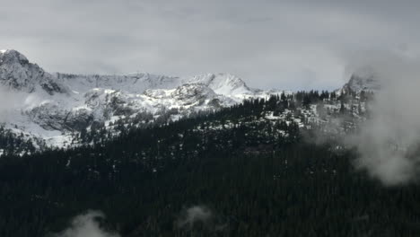 Green-snowy-mountain-forest-of-Whistler,-Canada--aerial