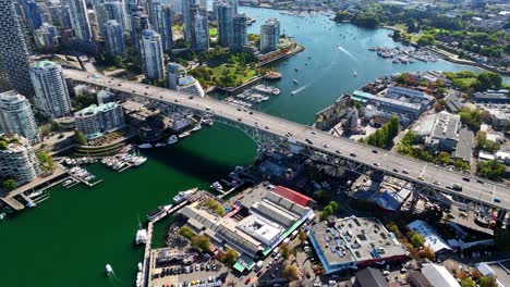 drone fly over granville street bridge with traffic in vancouver, british columbia, canada