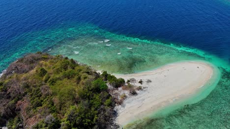 drop footage of a small tropical island with beach near palawan in the philippines