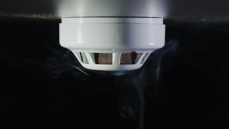 the smoke detector is triggered by a trickle of dum the red indicator lights up 4k video