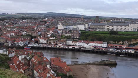 Panning-shot-of-Whitby-city-centre-along-the-Harbour-view-in-Yorkshire