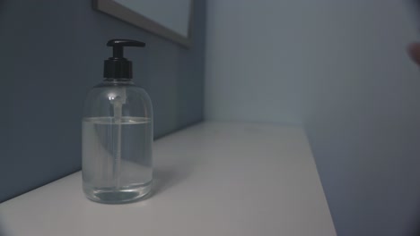 woman washing hands with hydroalcoholic gel