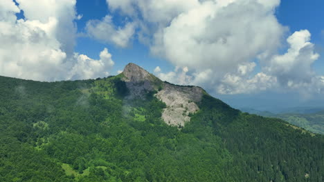 flight over green mountain peaks