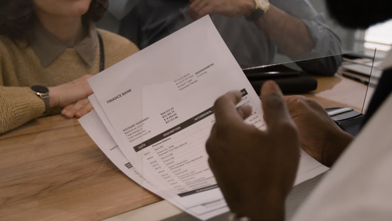 Customer reviewing account statement at a bank