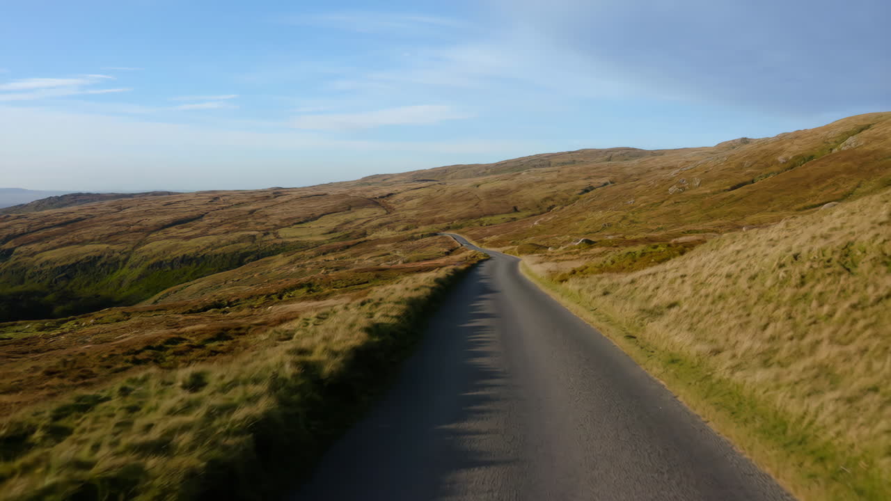 Winding Road Through a Grassy Mountain Landscape