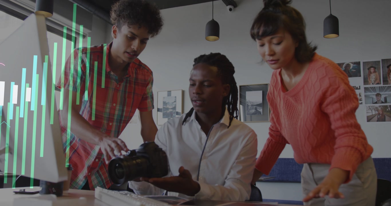 Team adjusting DSLR, shifting prints for creative review, watching bar-chart analytics on monitor