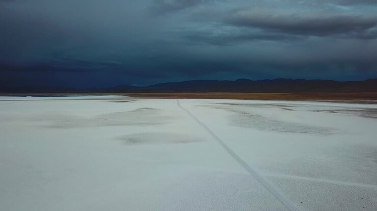Extraordinary Landscape, Aerial View of Salinas Grandes Salt Flat Argentina Under Stormy Dark Sky