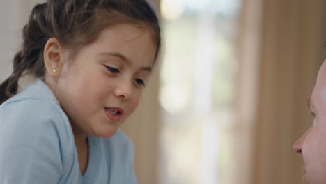 happy little girl playing game with father funny child whispering secrets having fun enjoying playful game with dad 4k