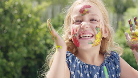 happy family  with little girl painting in the yard