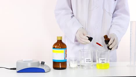 scientist performing iodine clock reaction experiment with laboratory equipment