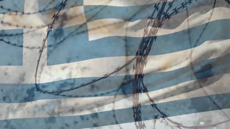 alambre de púas contra la bandera de grecia
