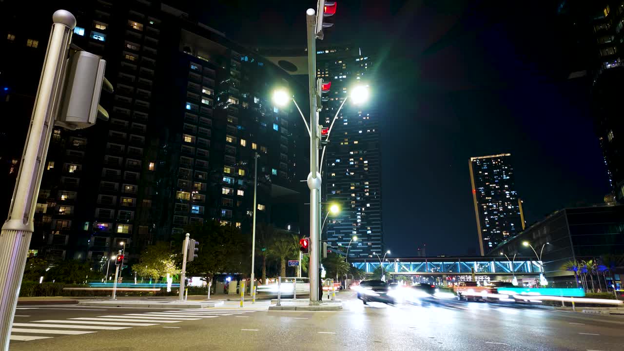 Busy city intersection at nighttime - panoramic motion hyper lapse