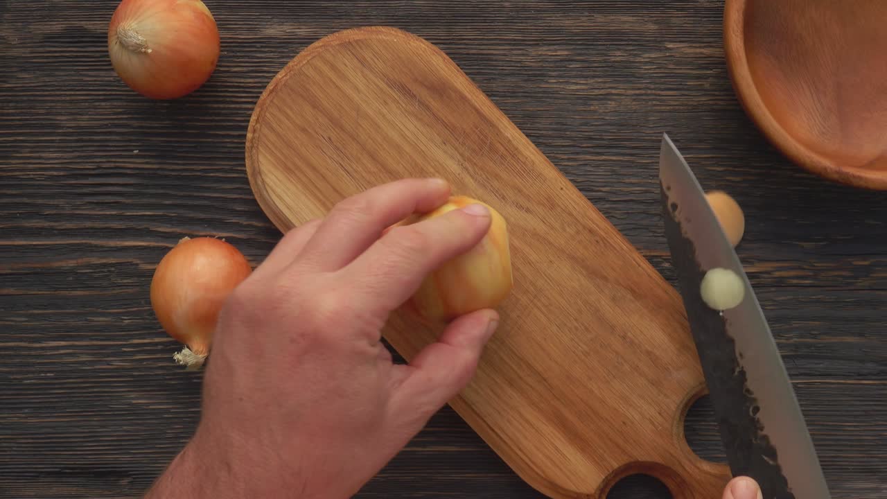 Top view of the knife peeling onion
