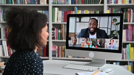 video call, online education. african american happy female student, learning distantly, watches online lecture, communicates with colleagues, multiracial people on computer screen, virtual meeting