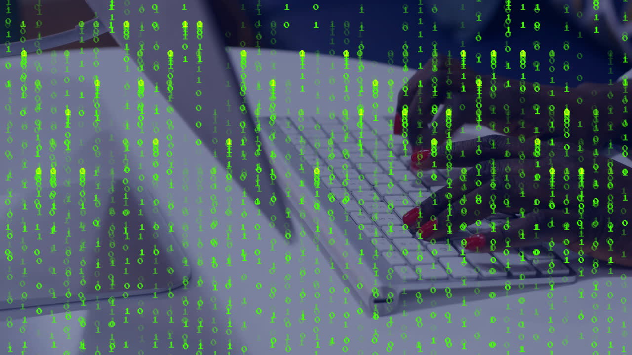 Developer typing on laptop keyboard in technology workspace, showing floating green binary code