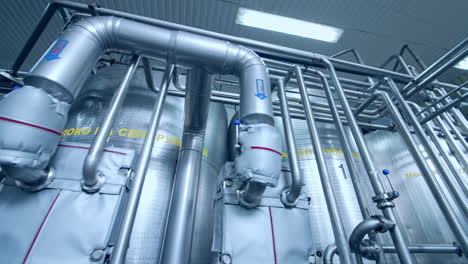 industrial dairy production factory. metallic stainless steel pipes in modern dairy plant