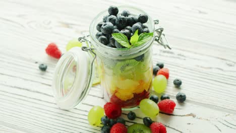 jar filled with colorful fruit