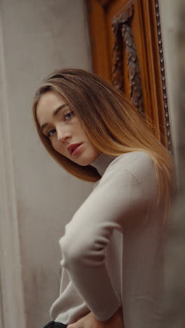 woman in beige sweater