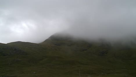 a shot of the mist and fog rolling through a mountain range near the village of tarbert on the isle of harris, part of the outer hebrides of scotland