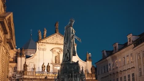 Nighttime-view-of-King-Charles-IV-statue-near-Prague's-bridge-gate-square