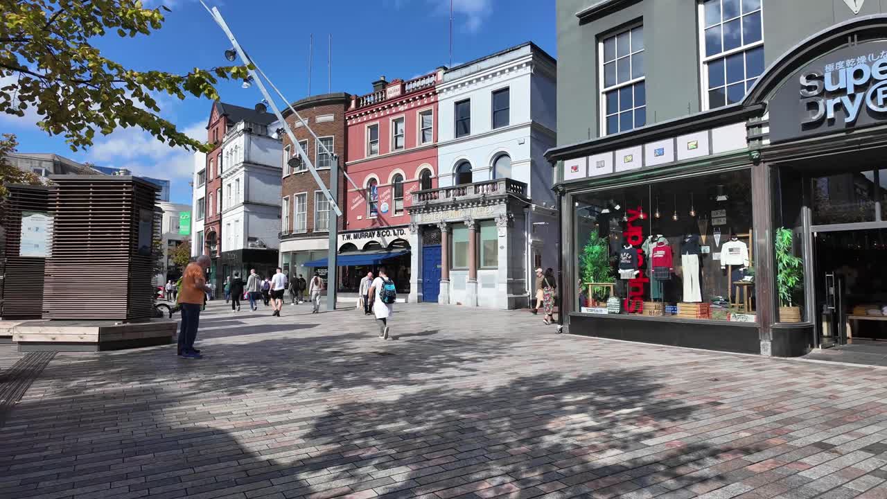 Cork City Opera house and Crawford gallery with pedestrians on sunny day. Ireland