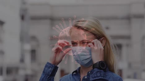 animation of covid 19 cells moving over woman in face mask