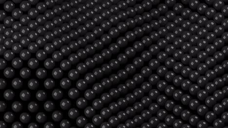 bolas negras 3d movimiento ondulado en un fondo oscuro. simple movimiento gráfico animación en bucle