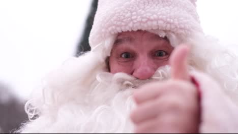 santa claus hand appears from the smart phone screen and shows direction with index finger cartoon character santa claus hand appears from the smart phone screen and shows direction with index finger attention and recommendation concept christmas 3d animation with red background