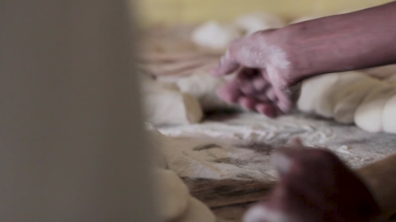 Closeup Of Baker Cooking Naan Flat Bread, Pakistan.