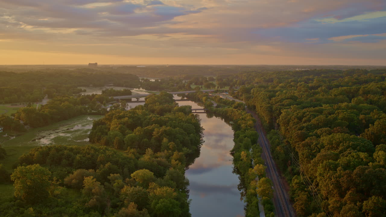 Drone view of the Huron River in Ann Arbor, Michigan, gliding slowly above in summer.