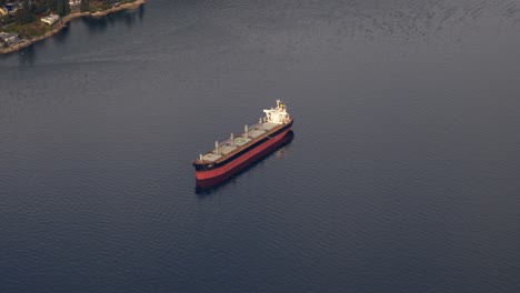 bulk carrier sailing across the water. aerial shot