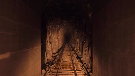 pov of a moving train passing through a narrow tunnel